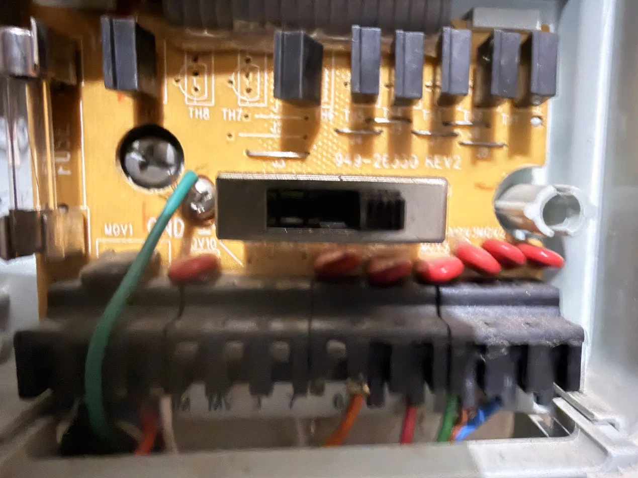 Power board showing station triacs TH1 to TH8, red MOVs, a glass fuse and the field terminal block